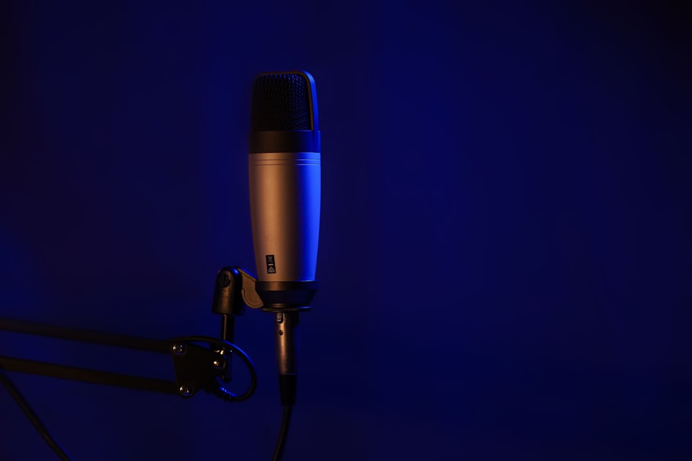 a microphone on a stand in a dark room