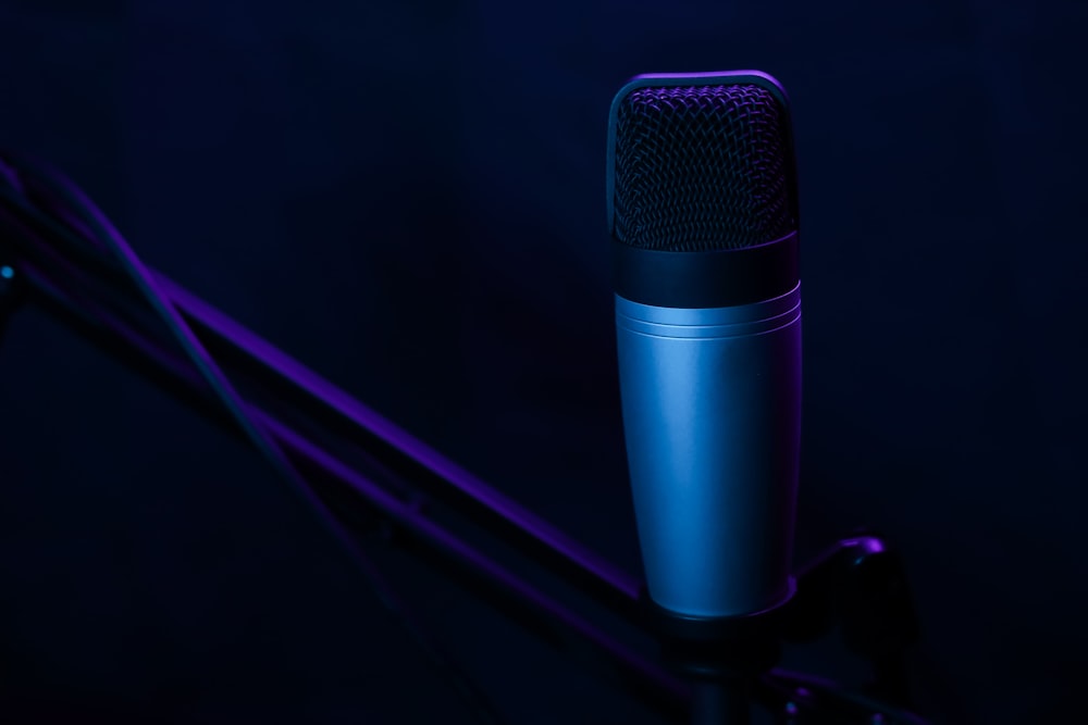 a microphone on a stand in a dark room