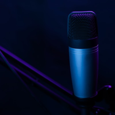 a microphone on a stand in a dark room