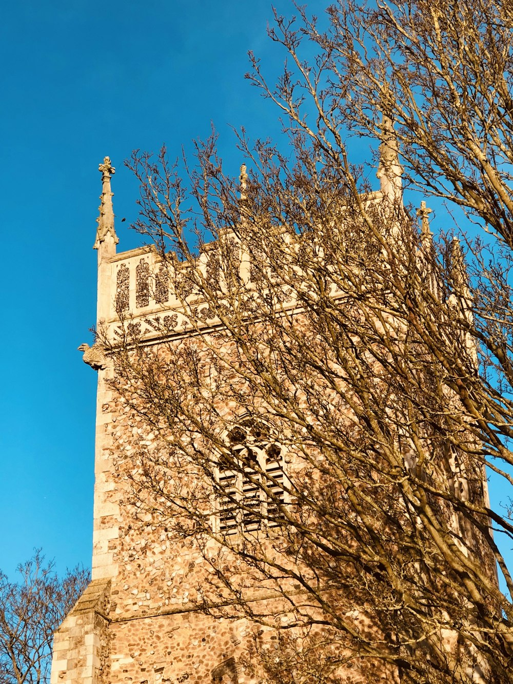 a tall tower with a clock on the top of it