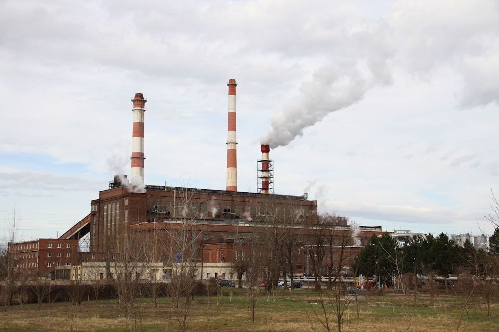 a factory with smoke coming out of it's stacks