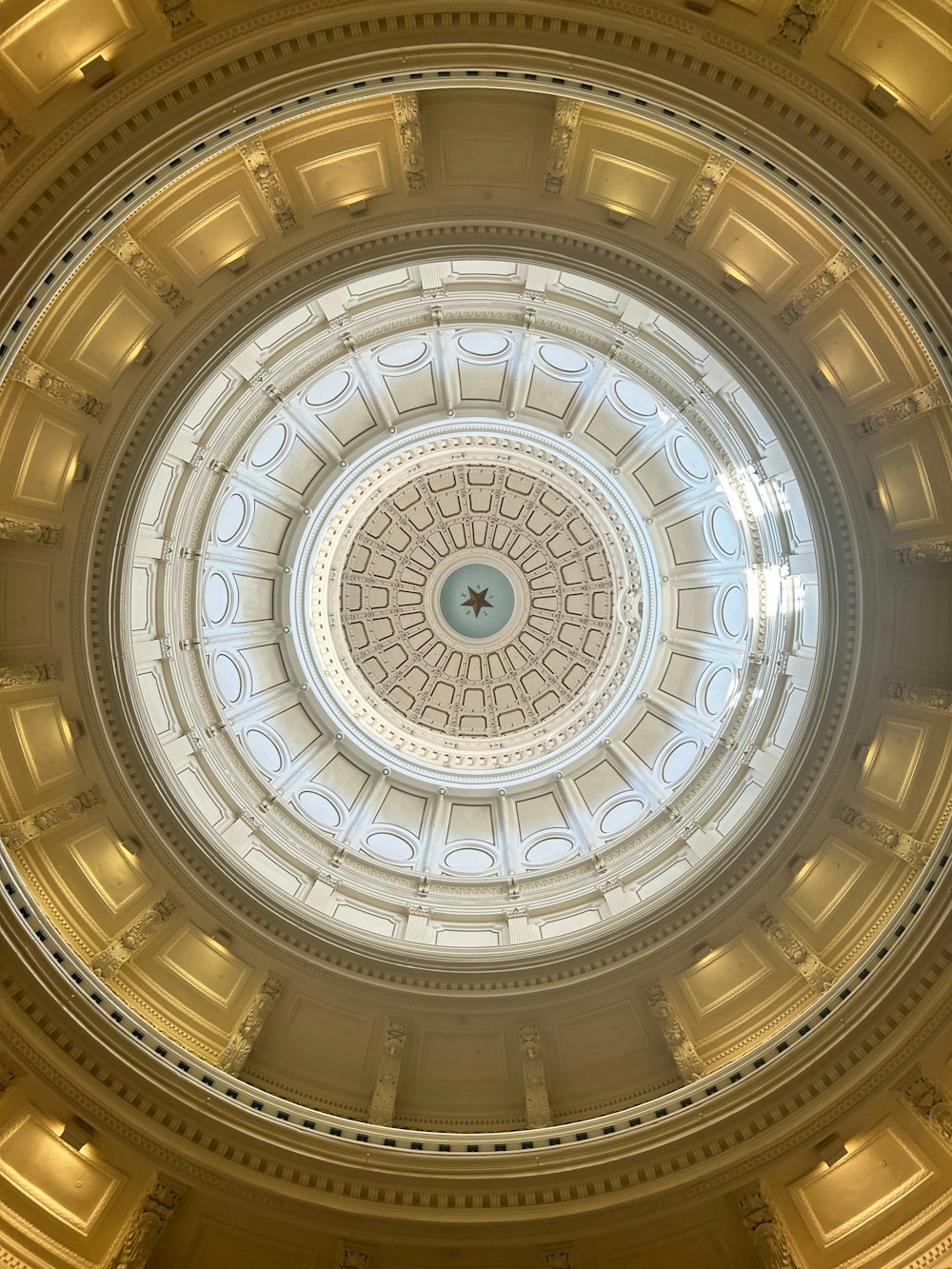 the ceiling of a building with a circular light