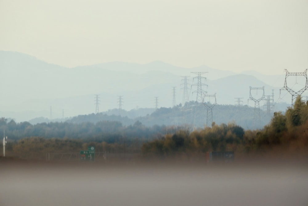 a hazy view of power lines in the distance