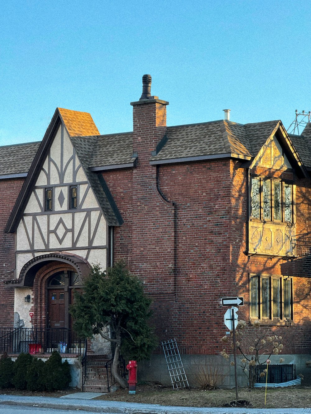 a large brick building with a clock on the front of it