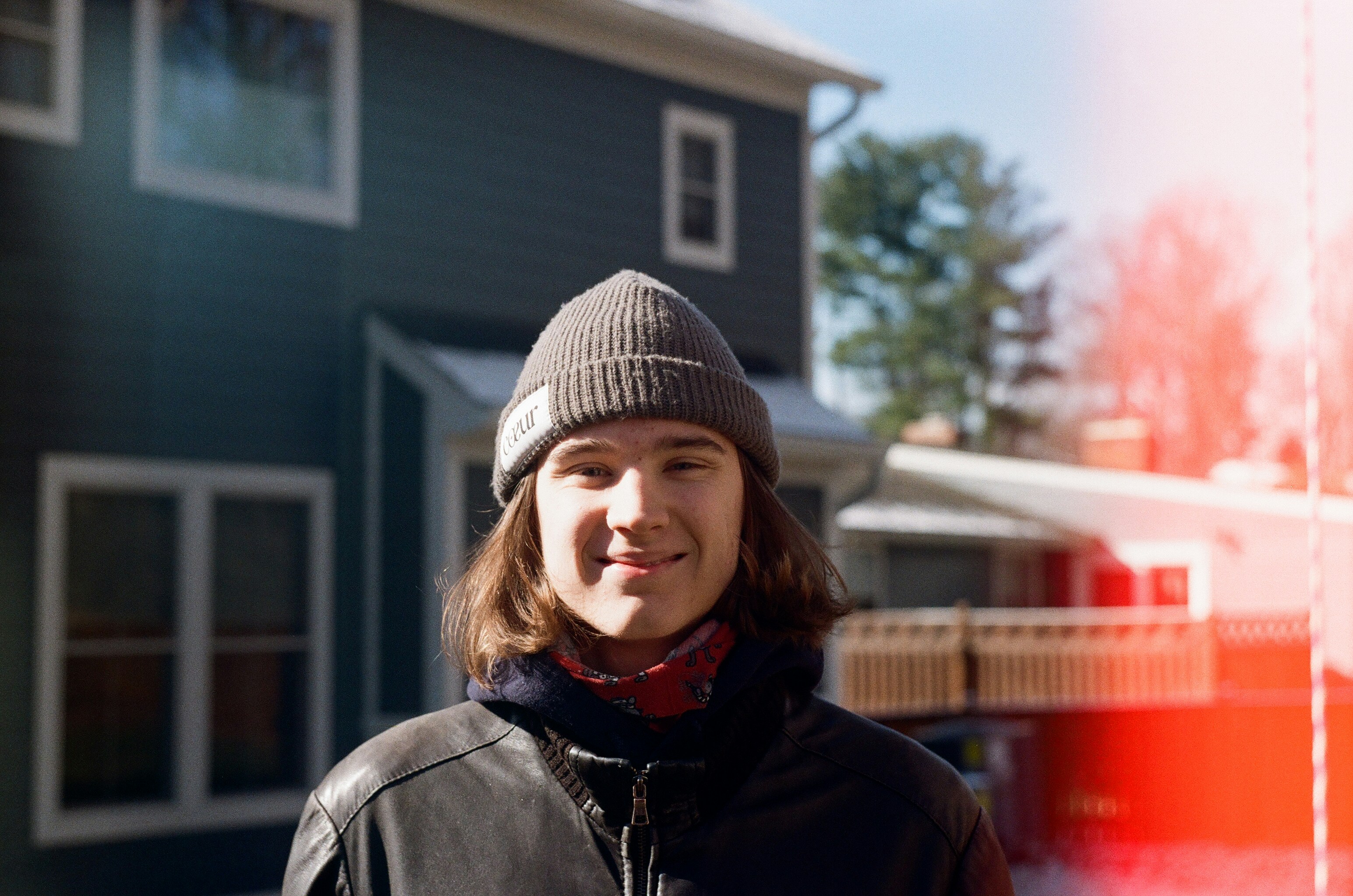 Happy customer in front of a house with electrician