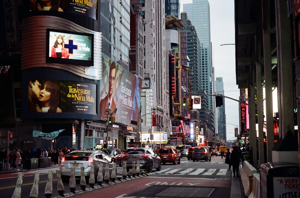 a city street filled with traffic and tall buildings