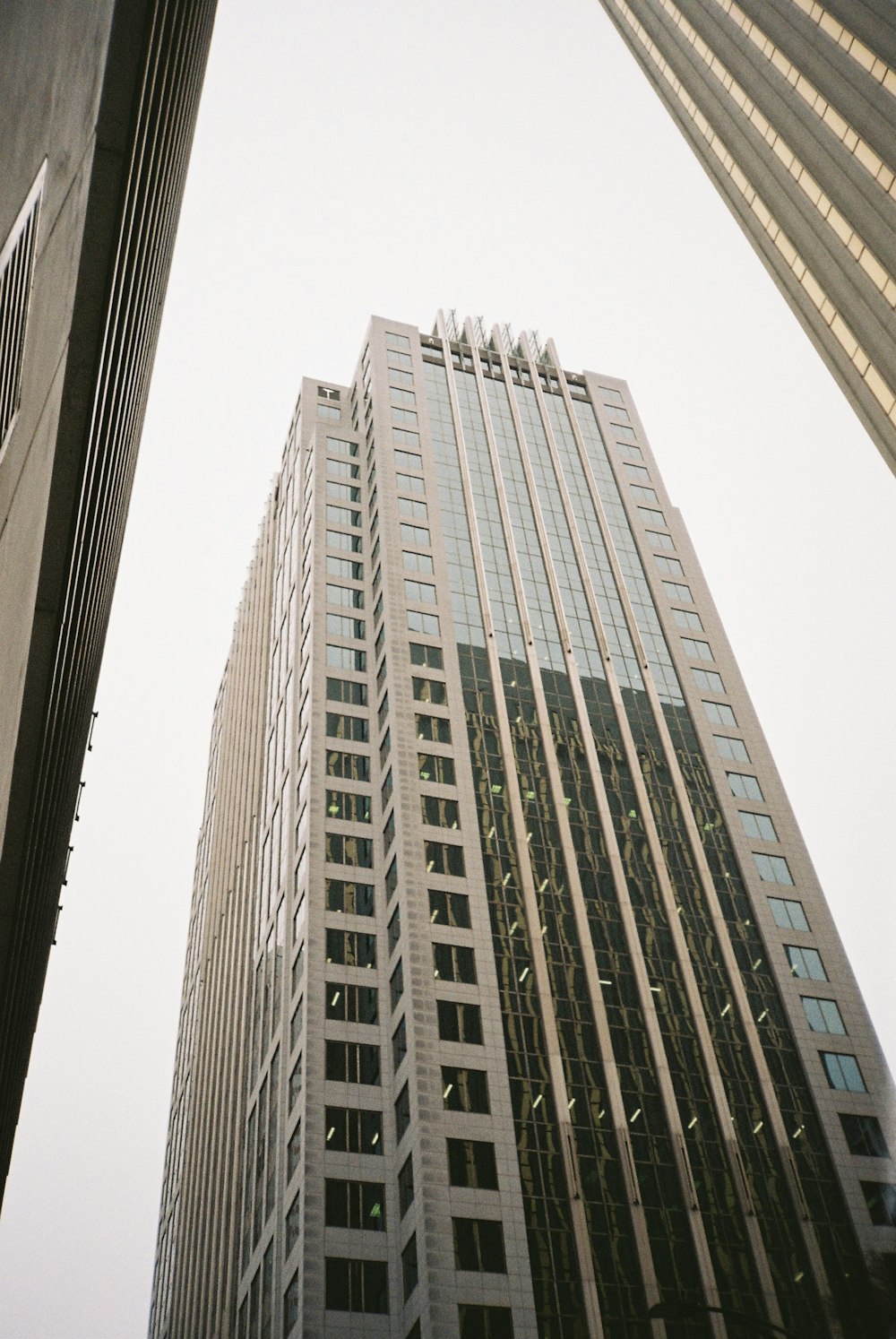 a view of a very tall building from the ground