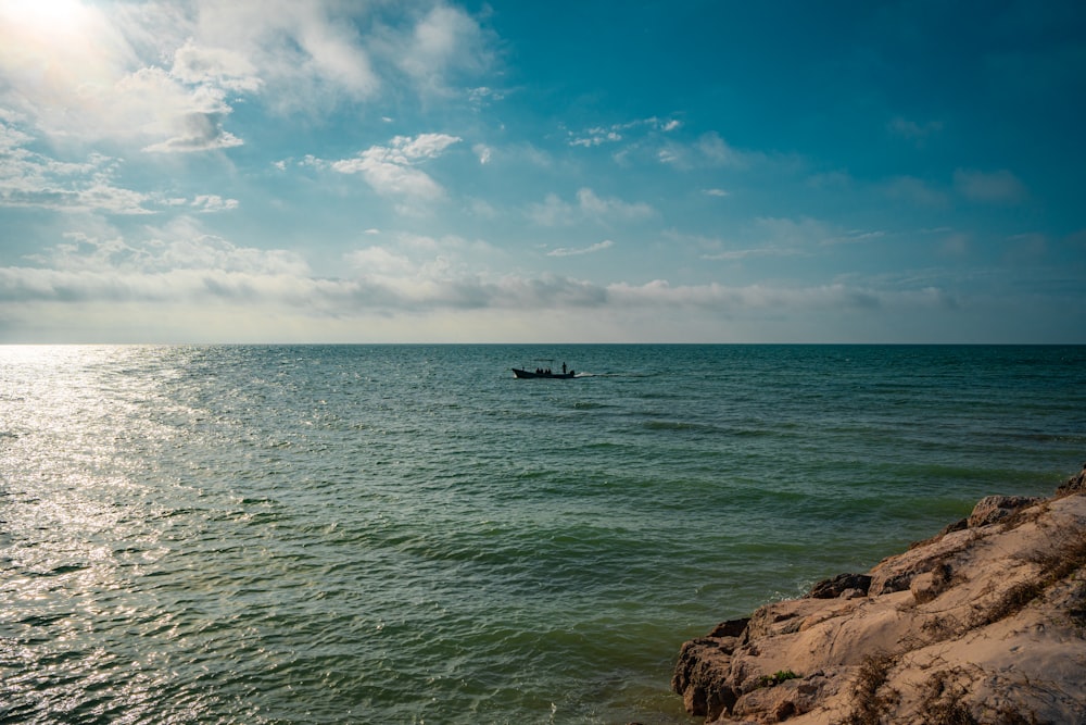 a small boat is out on the water