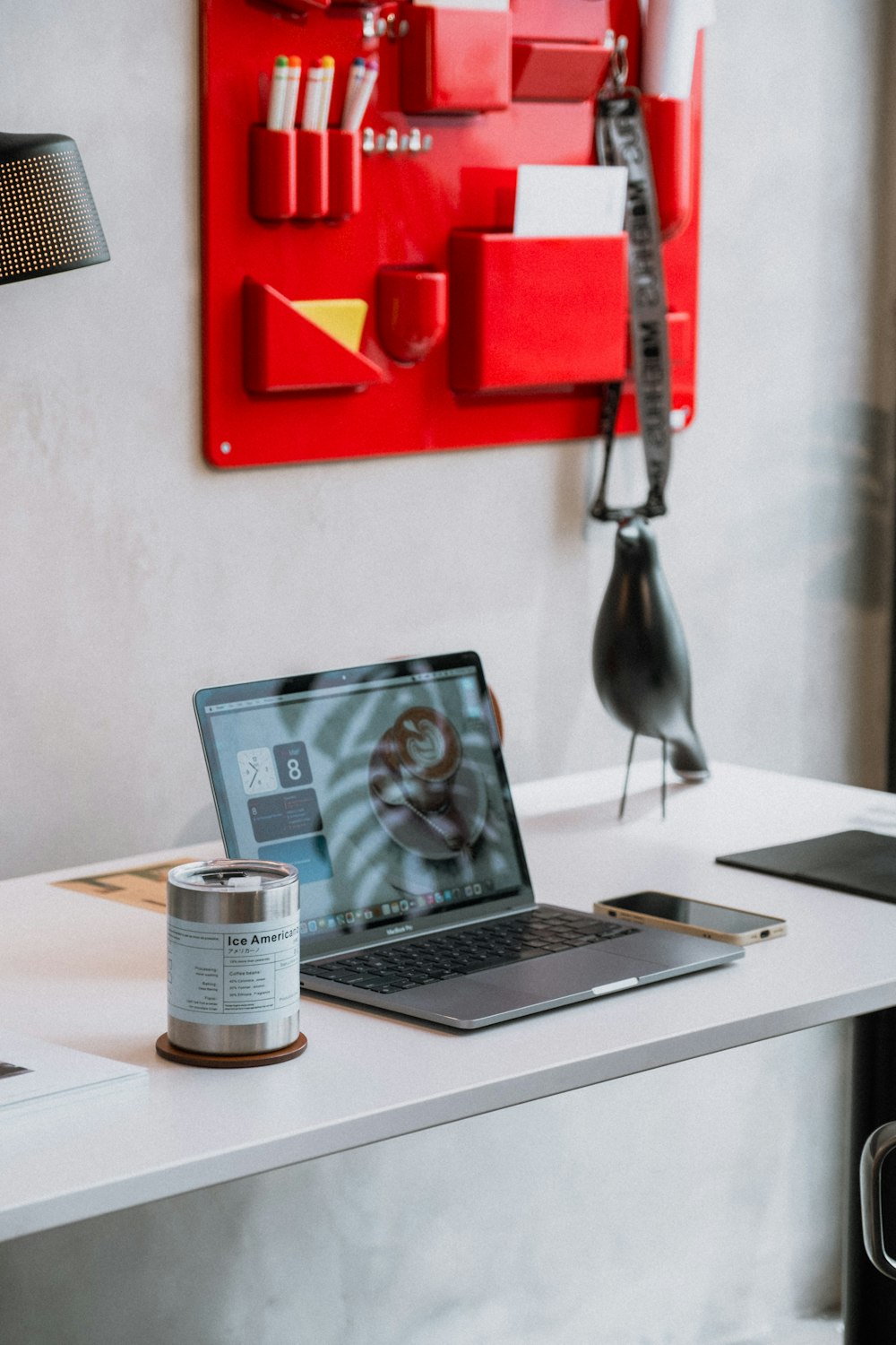 a laptop computer sitting on top of a white desk