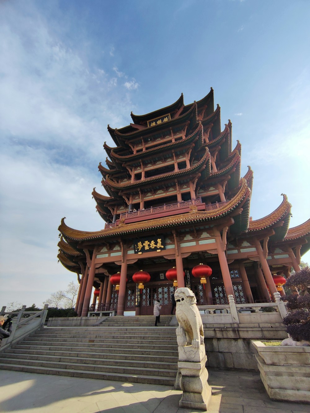 a large building with a statue in front of it