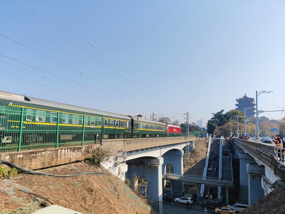 a train traveling over a bridge over a river