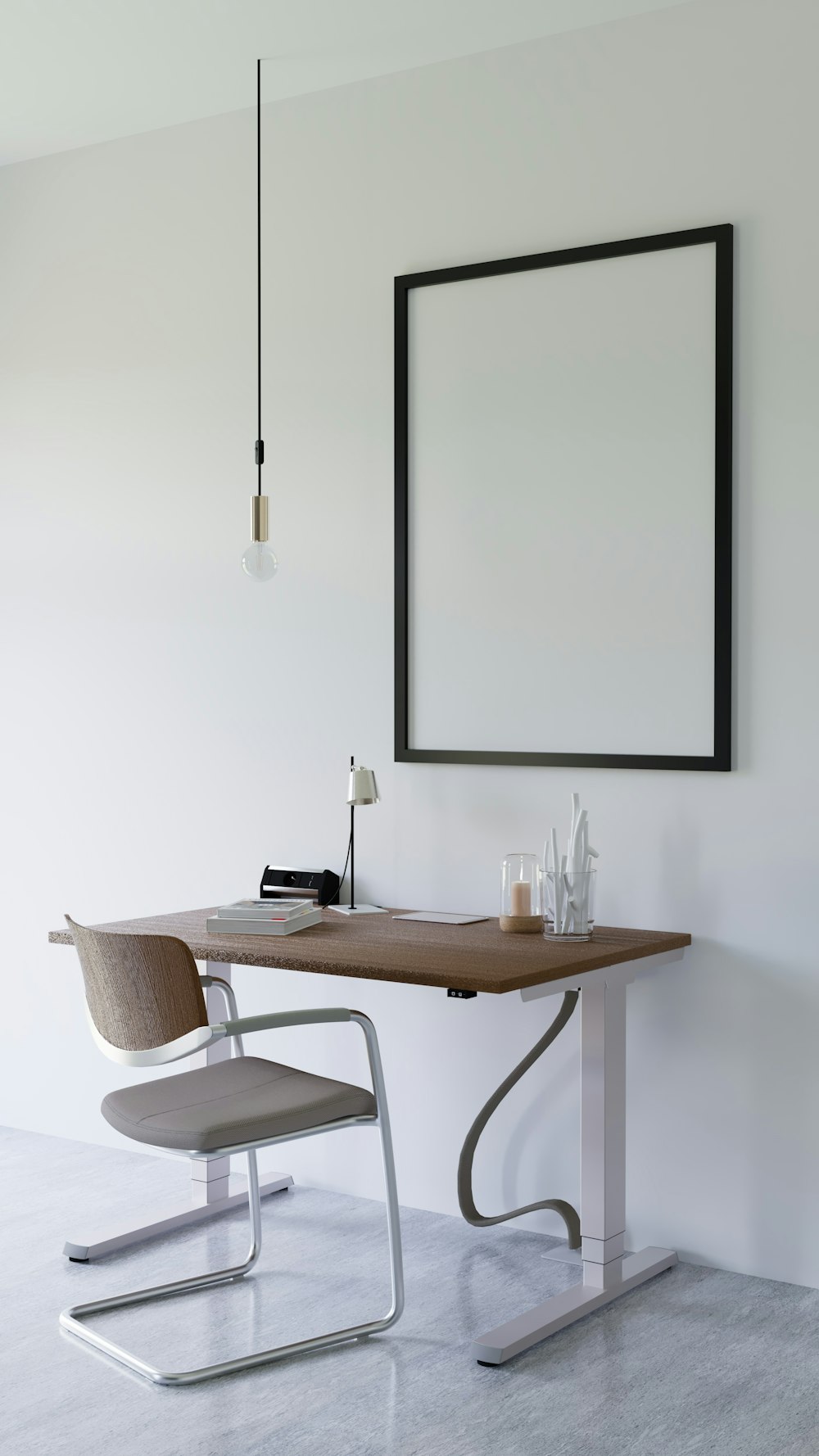 a desk with a chair and a framed picture