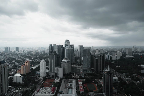 an aerial view of a city with tall buildings