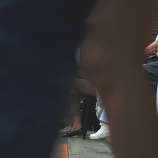 a group of people sitting on a bus next to each other