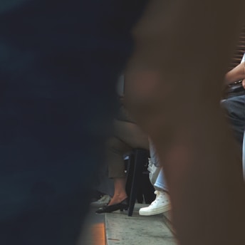 a group of people sitting on a bus next to each other