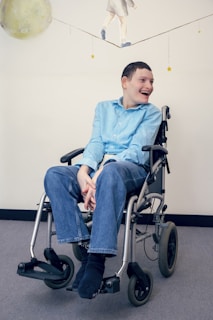 a man sitting in a wheel chair in a room