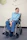 a man sitting in a wheel chair in a room