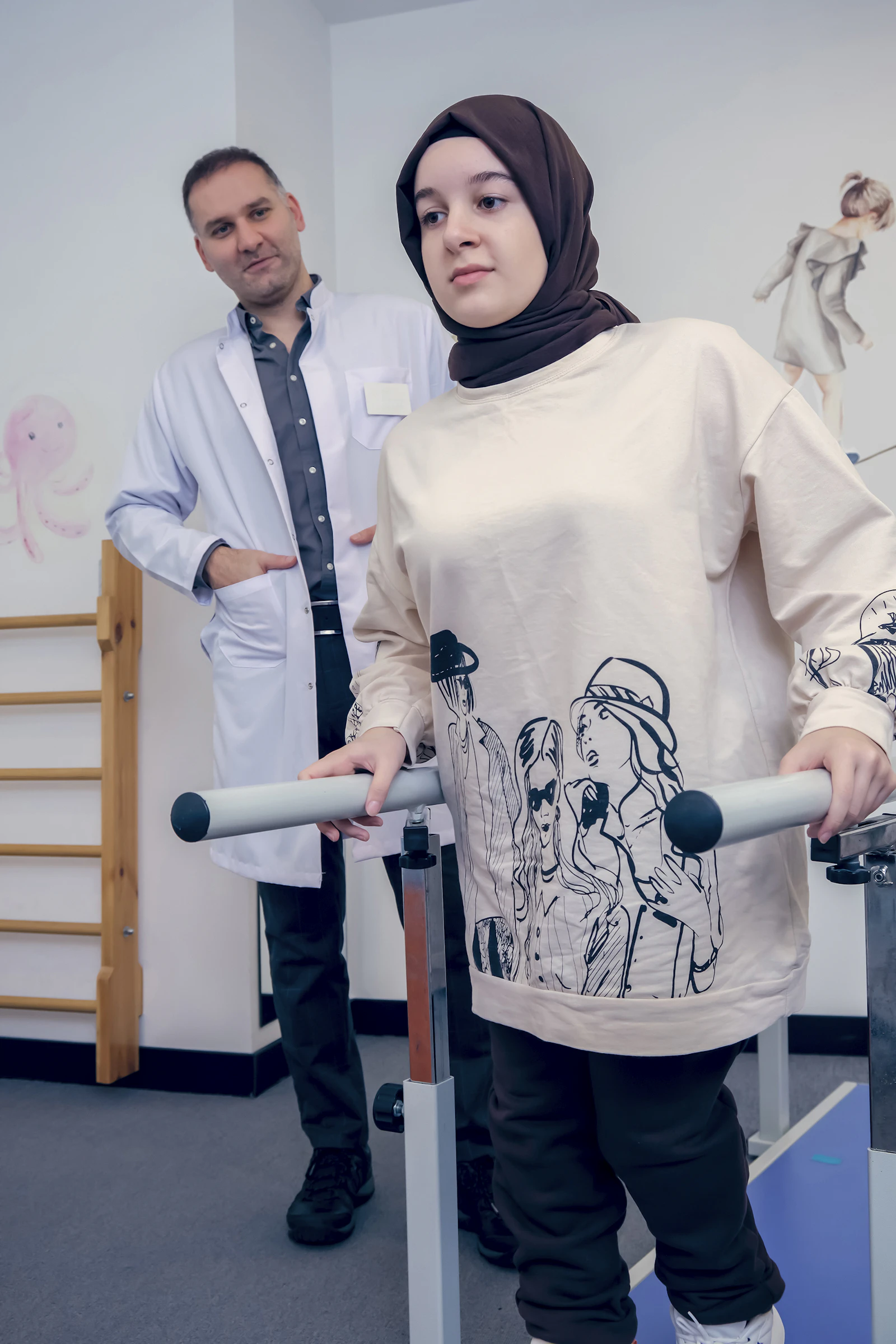 Dr Farhan Qureshi assessing a runner in the movement lab