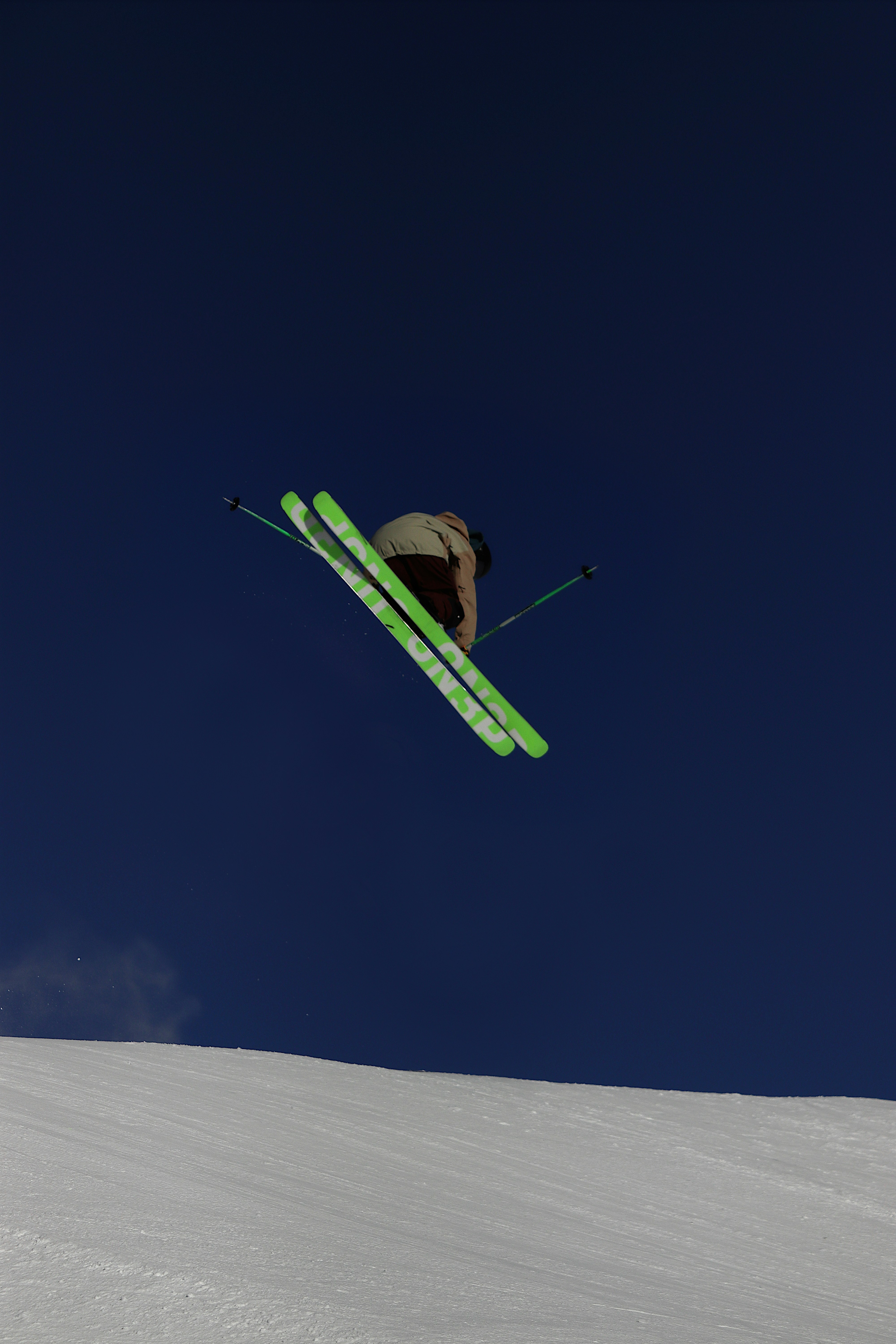 a man flying through the air while riding skis