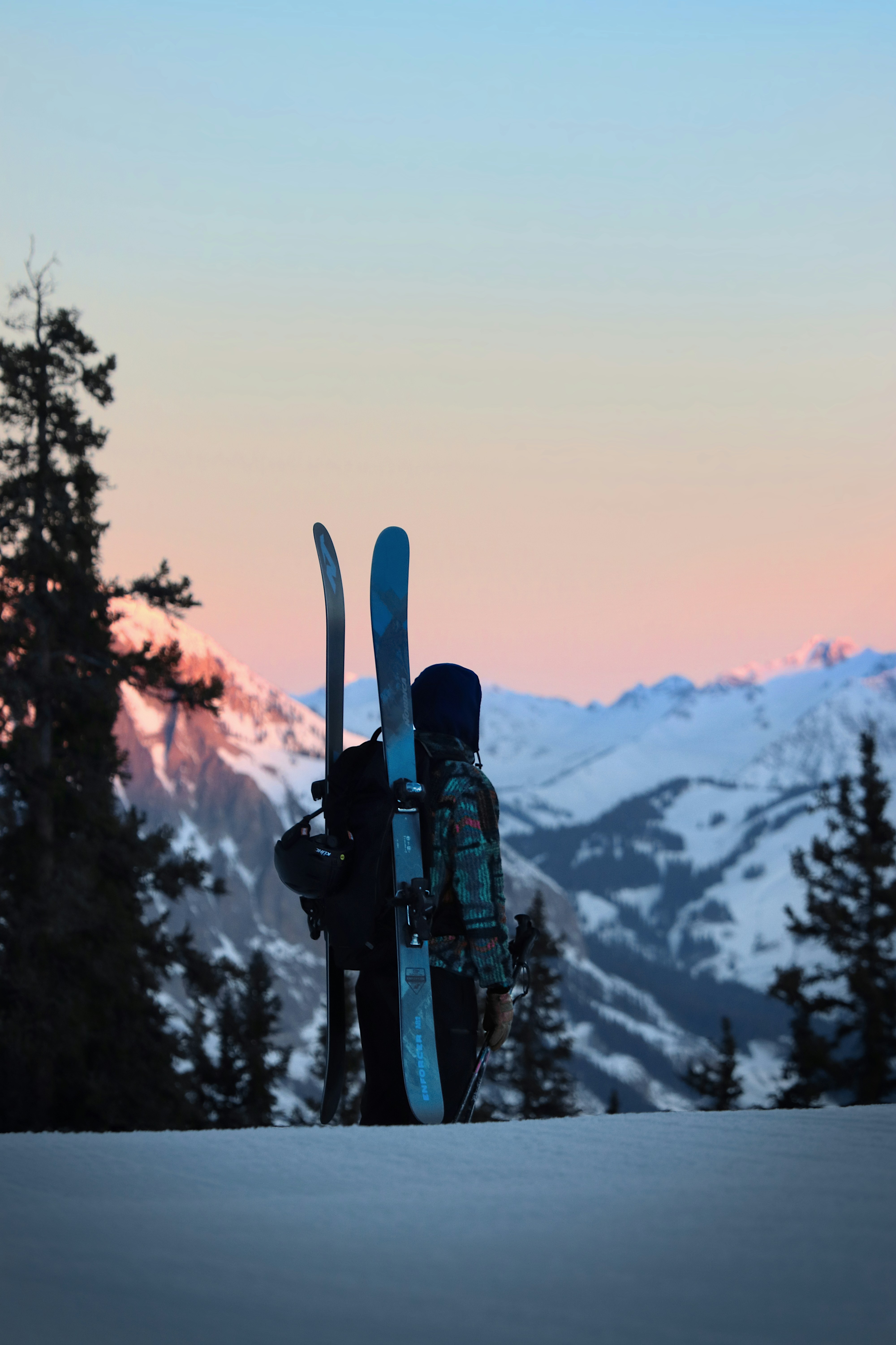 a pair of skis strapped to the back of a backpack