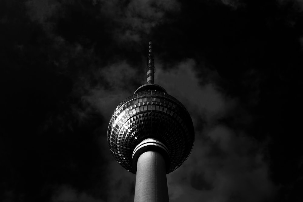 a black and white photo of a tall tower