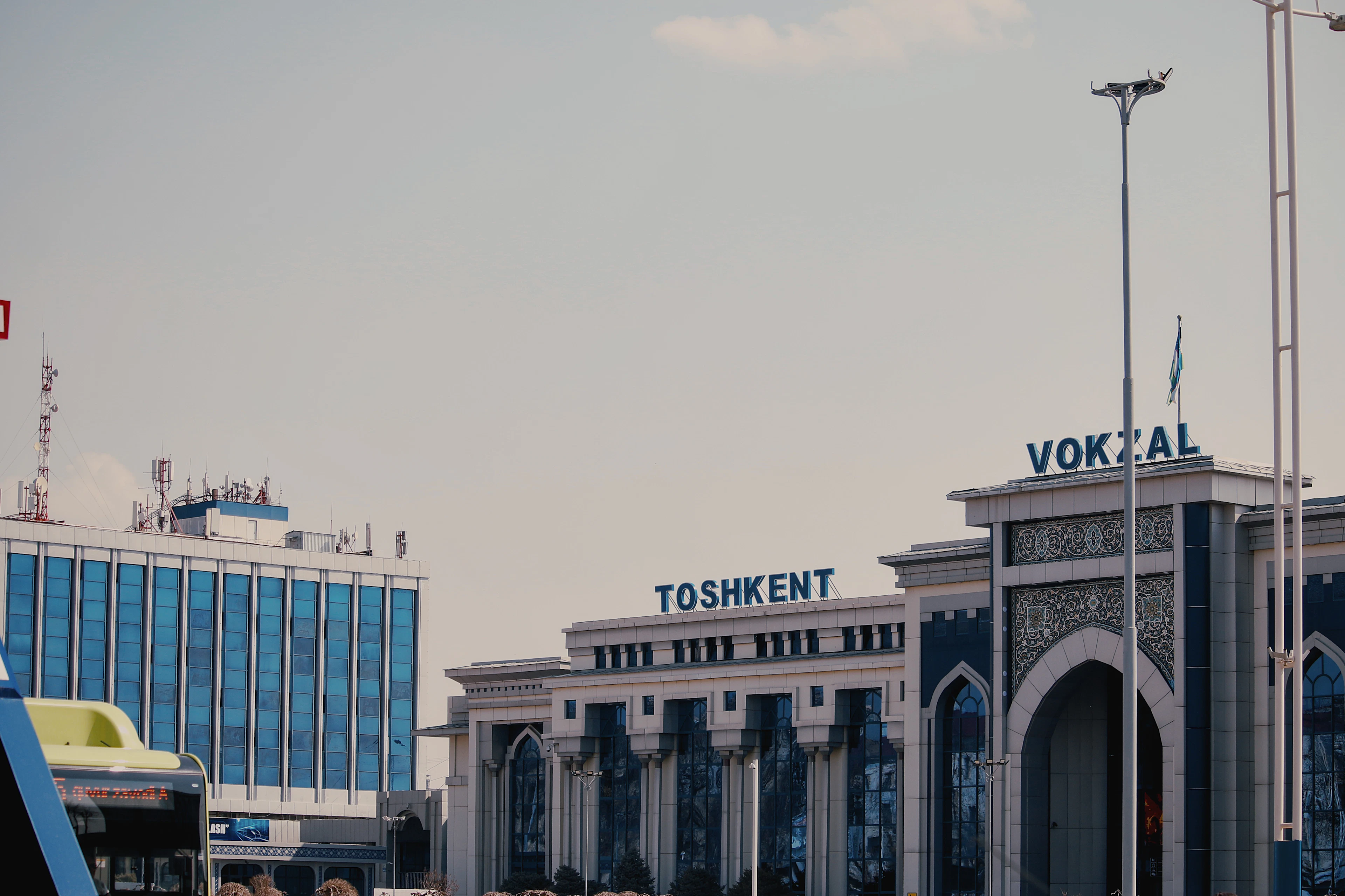 The frontage of Tashkent's central railway station, its arcade and lettering along the platform side