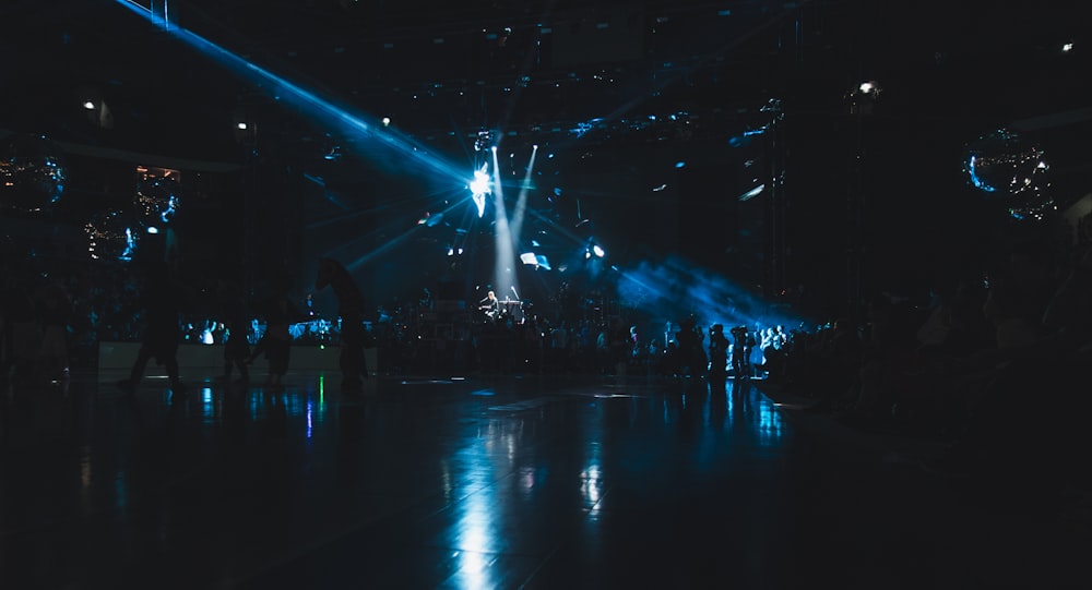 a group of people standing around a stage