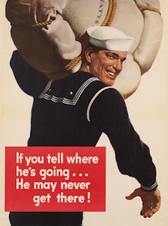 a man in a sailor's uniform carrying a large bag