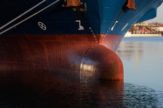 a large blue and red boat in the water