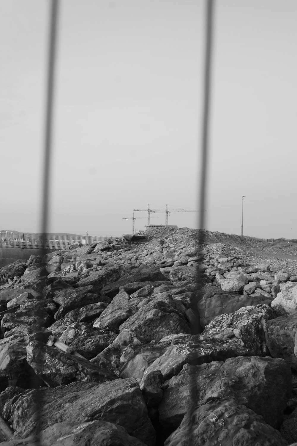 a black and white photo of a rocky beach