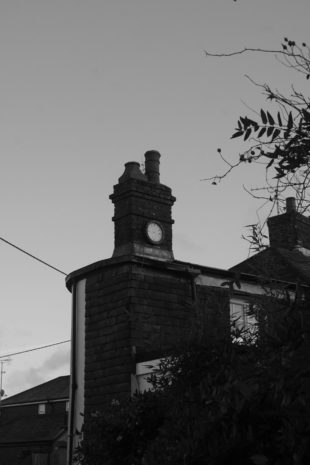 a black and white photo of a clock tower