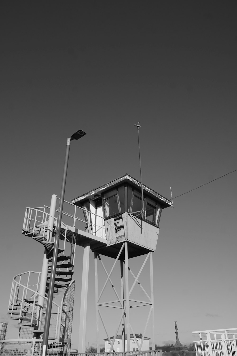 a black and white photo of a lifeguard tower