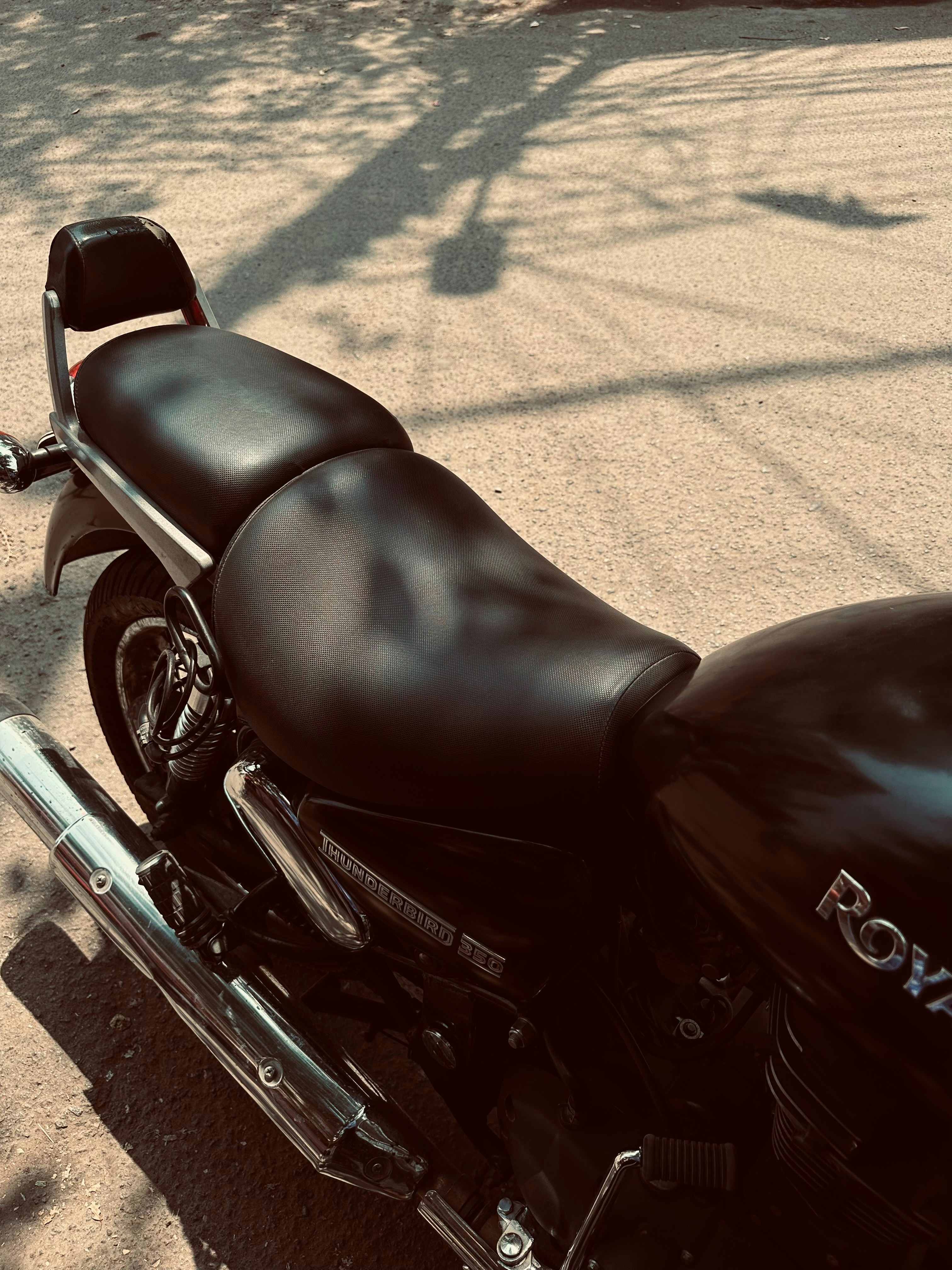 a black motorcycle parked on the side of the road
