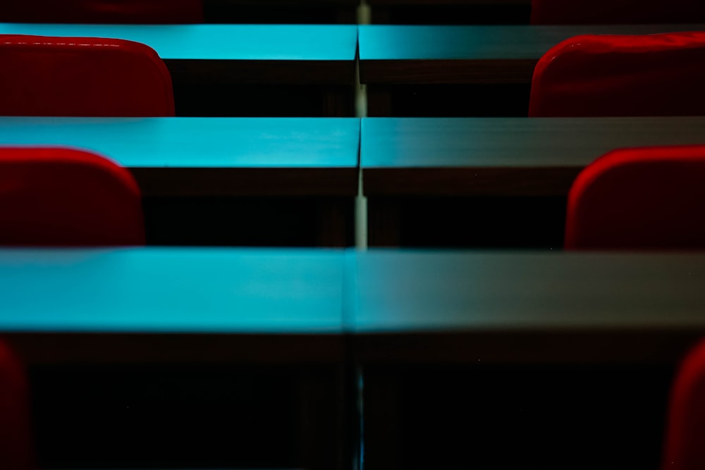 a row of red chairs sitting next to each other