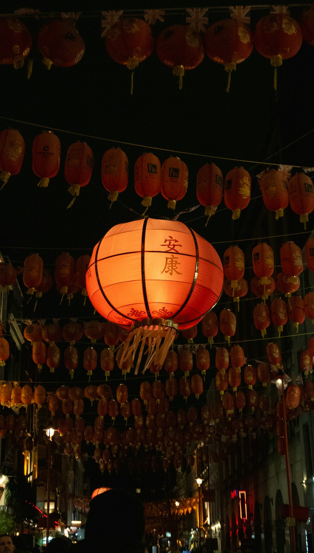 a group of lanterns hanging from the ceiling