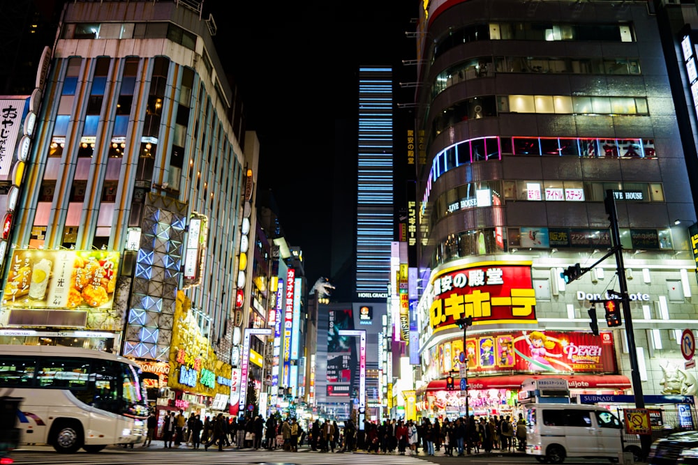 a city street filled with lots of traffic and tall buildings