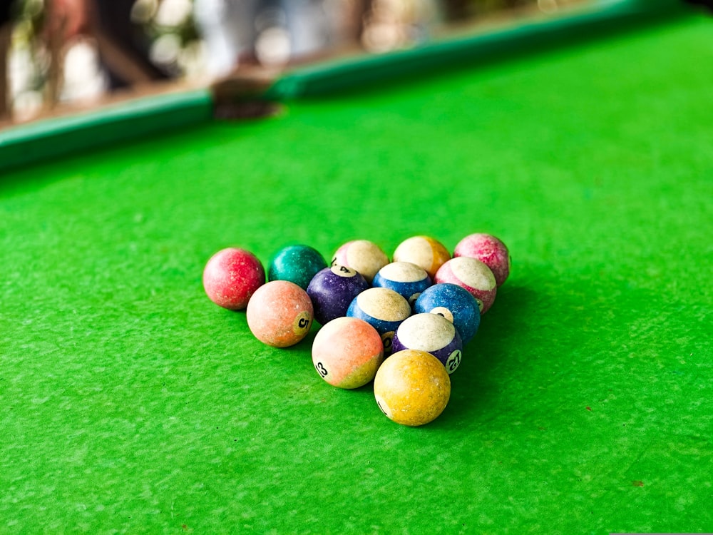 a pool table with a bunch of balls on it