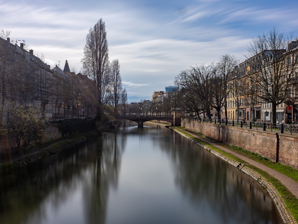 a river running through a city next to tall buildings