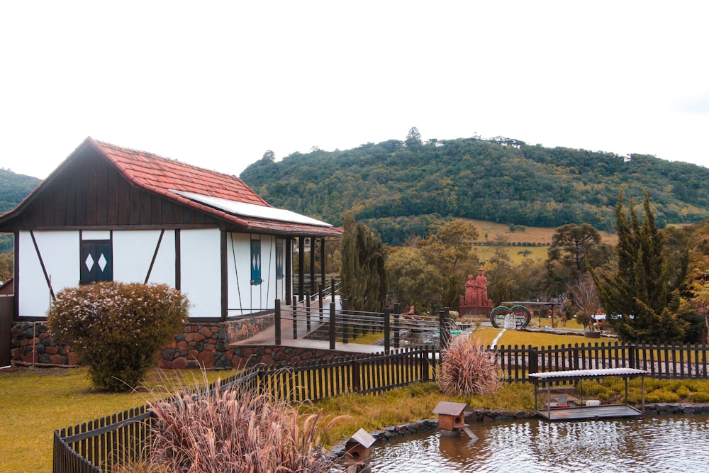 a house with a pond in front of it