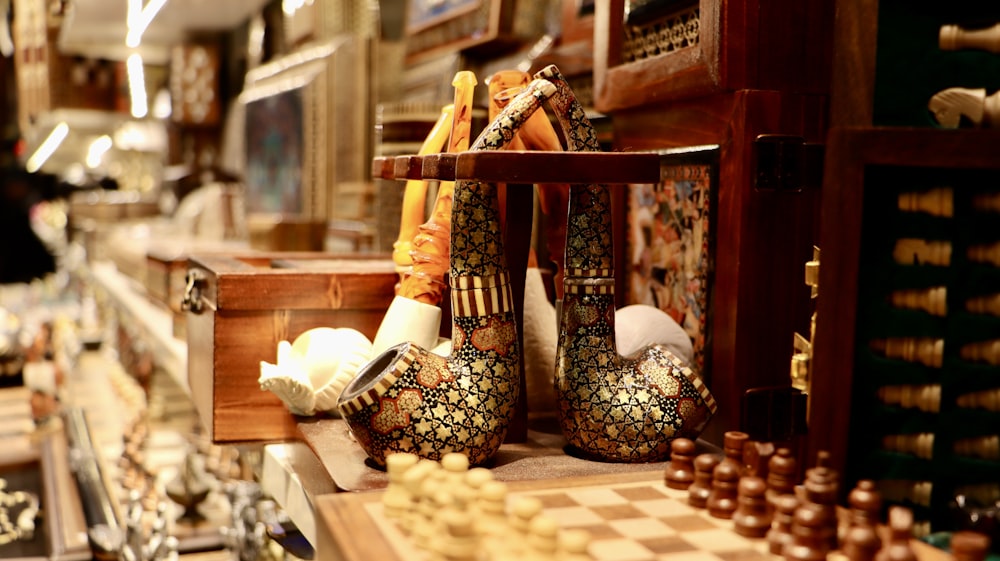 a table with chess pieces and other items on it