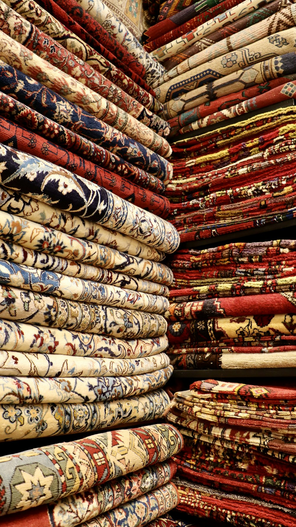 a pile of rugs stacked on top of each other