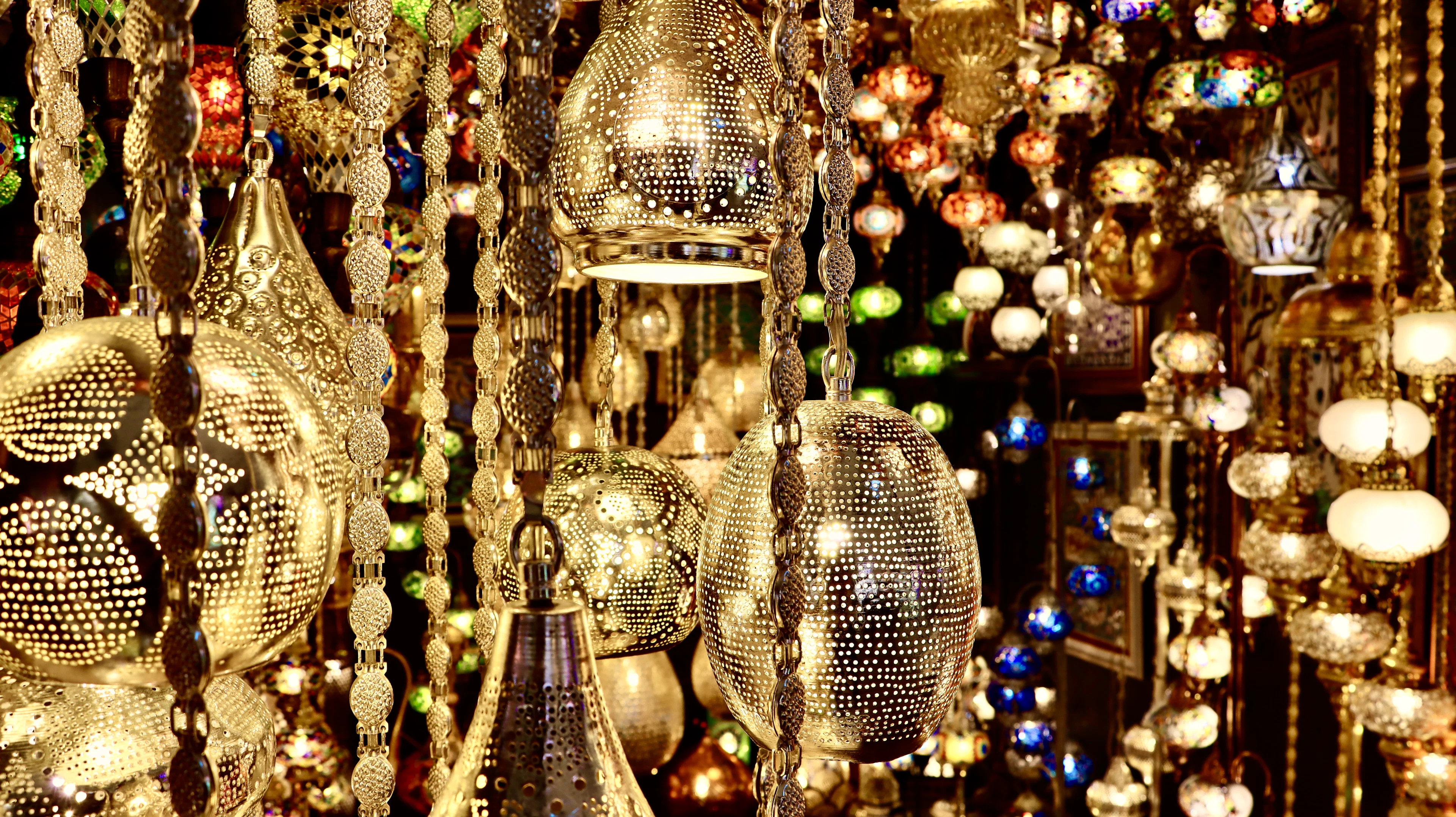 Pierced metal and coloured-glass lamps hanging in the Grand Bazaar, Istanbul