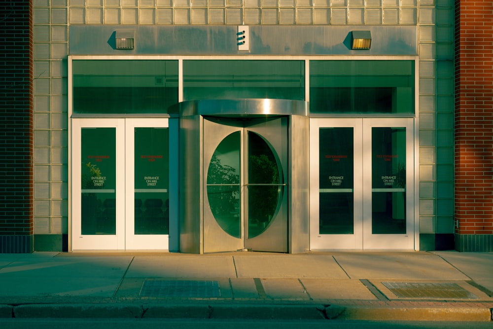 a building with a large door and a clock on the front of it