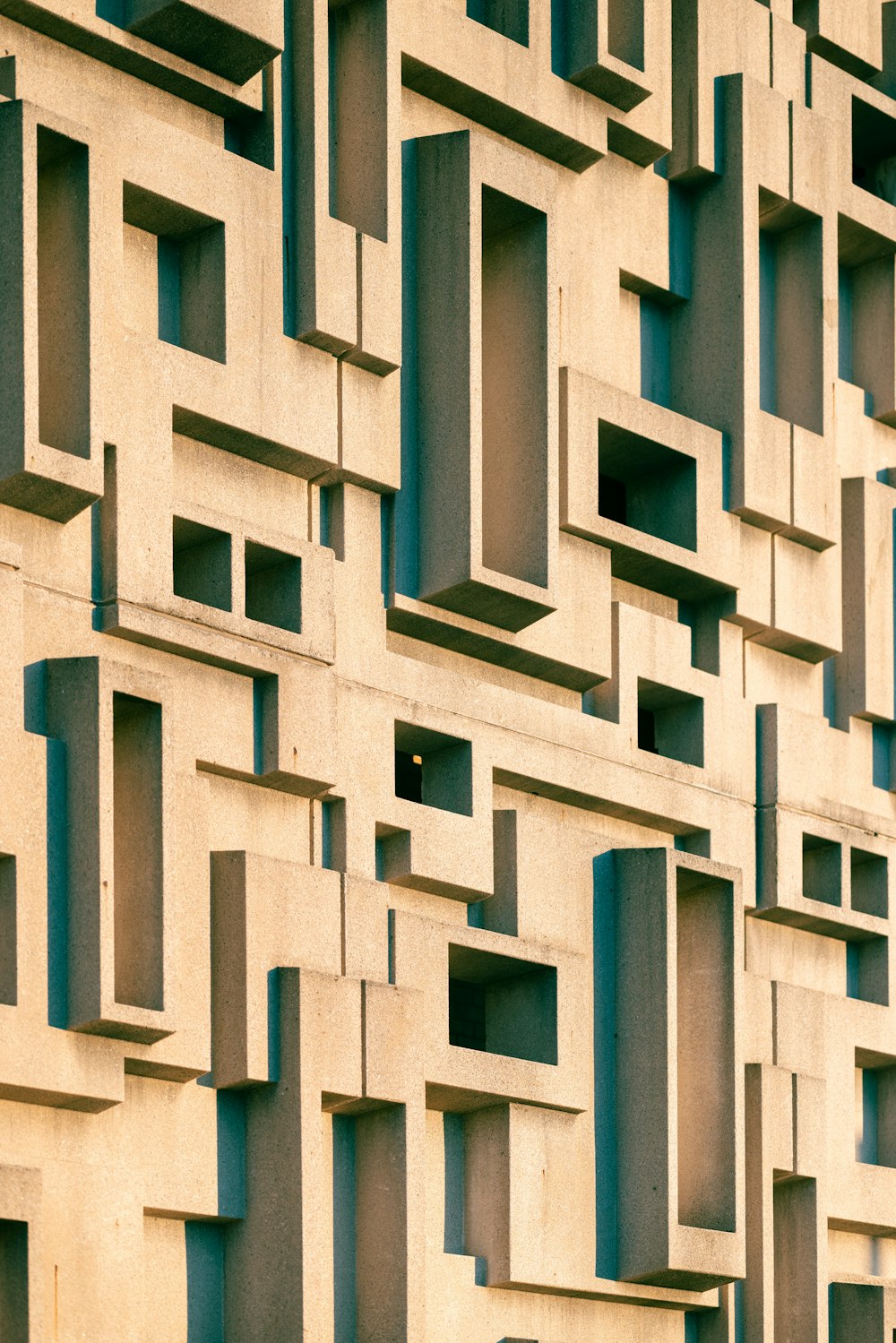 a building made of blocks with a clock on the front of it