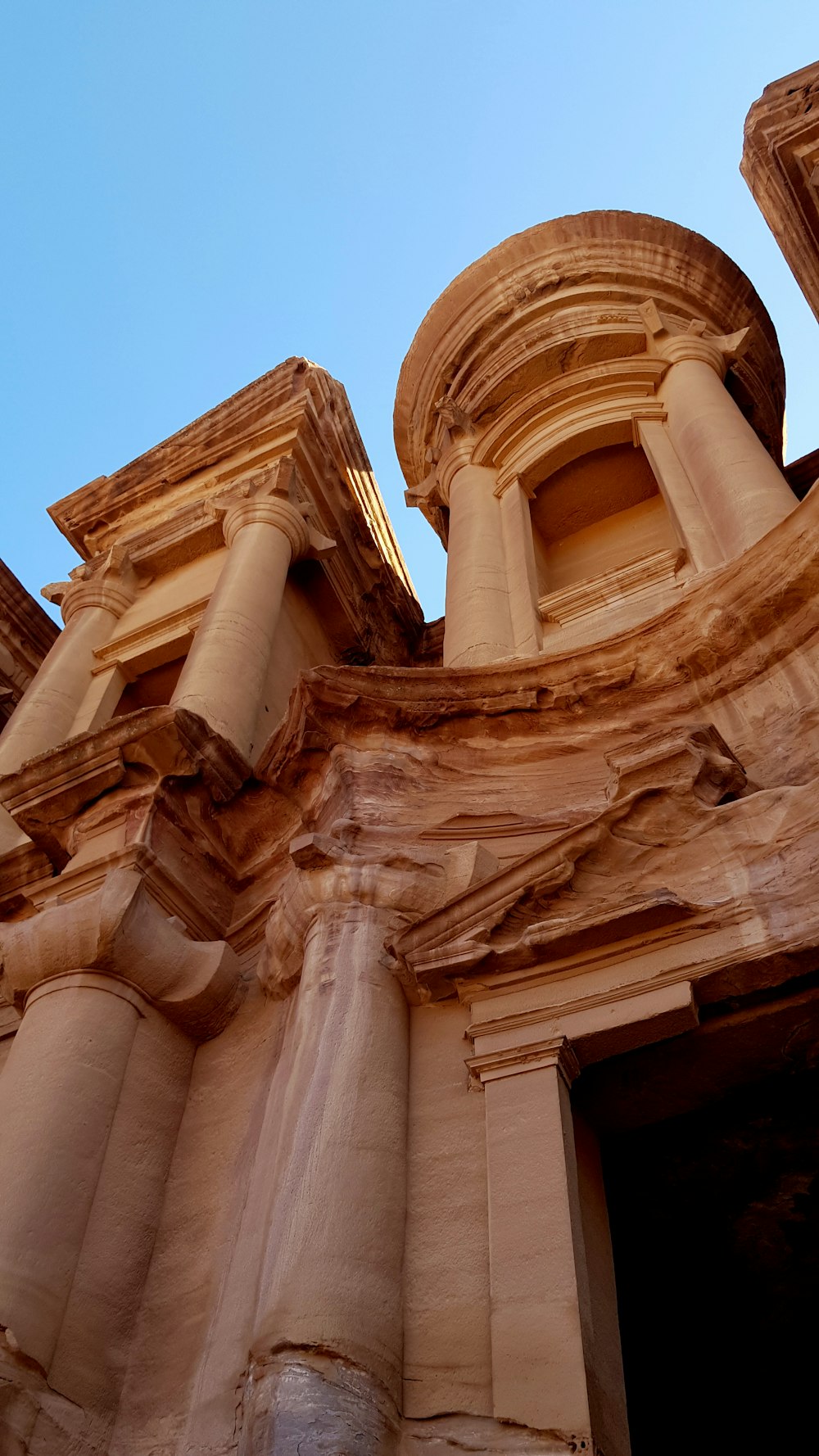 a very tall building with some columns on top of it