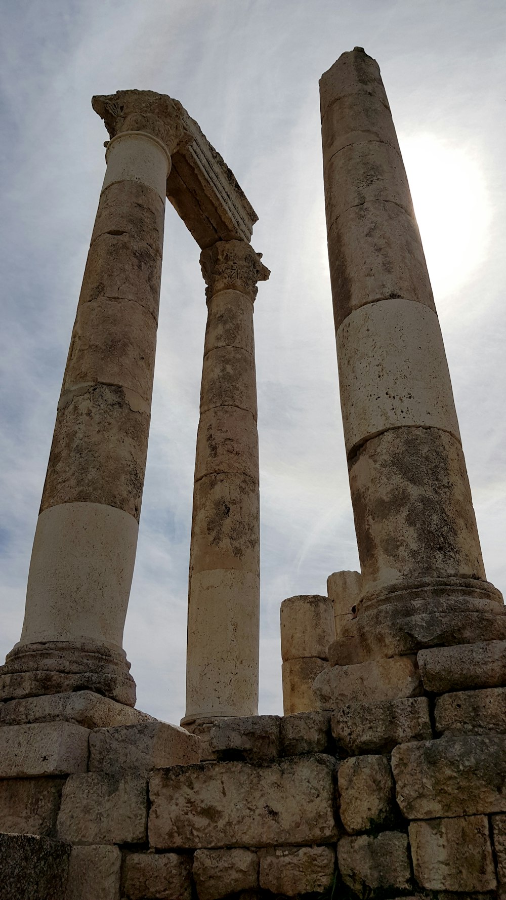 a couple of tall stone pillars sitting next to each other