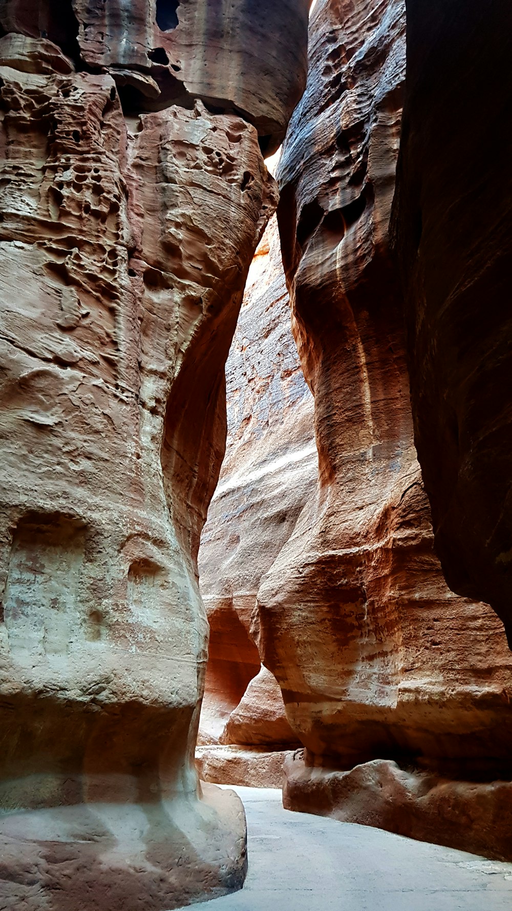 a narrow slot in the side of a mountain