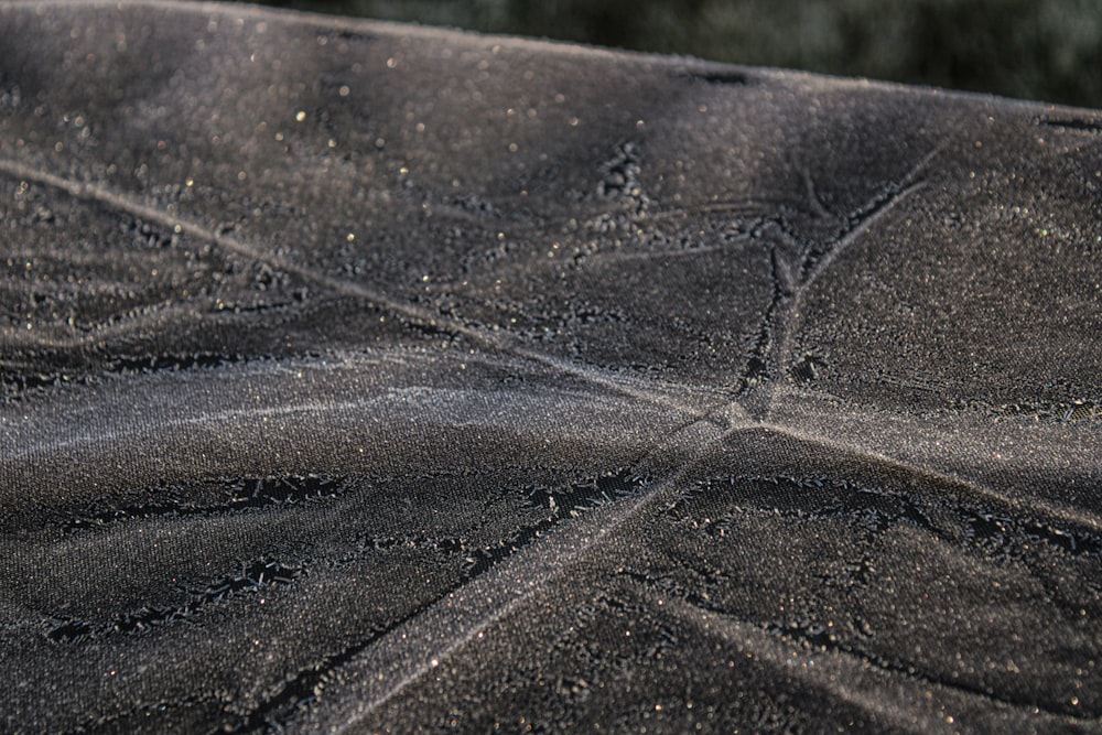 a close up of a black sand beach