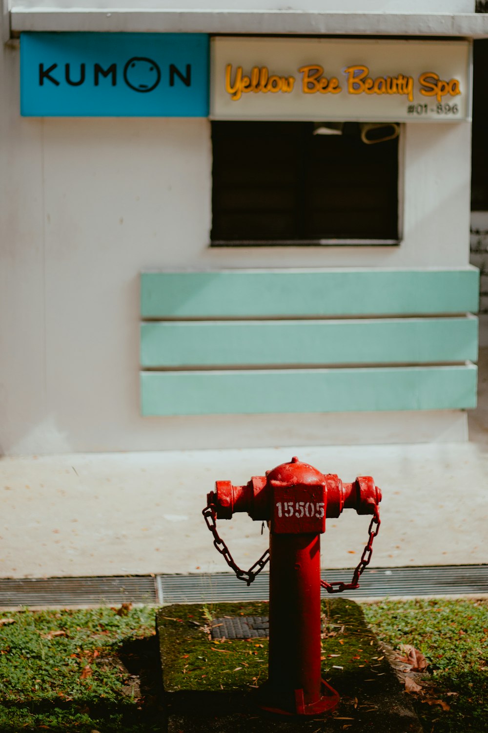 a red fire hydrant in front of a building