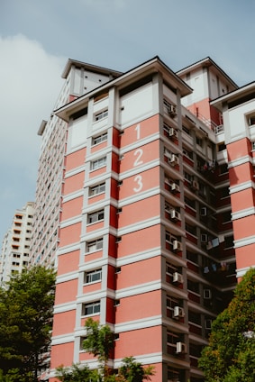 a tall building with a clock on the side of it